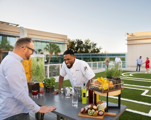 Chef laughing with bartender.
